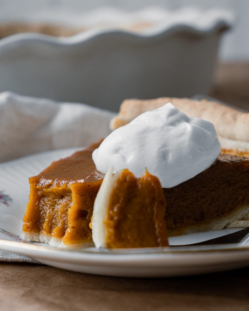 pumpkin pie with bite taken close up