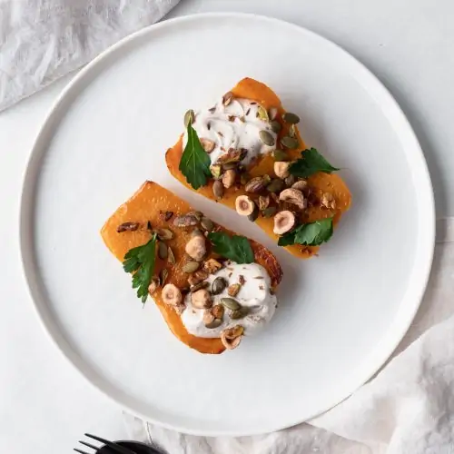 halved butternut pumpkin on plate from above