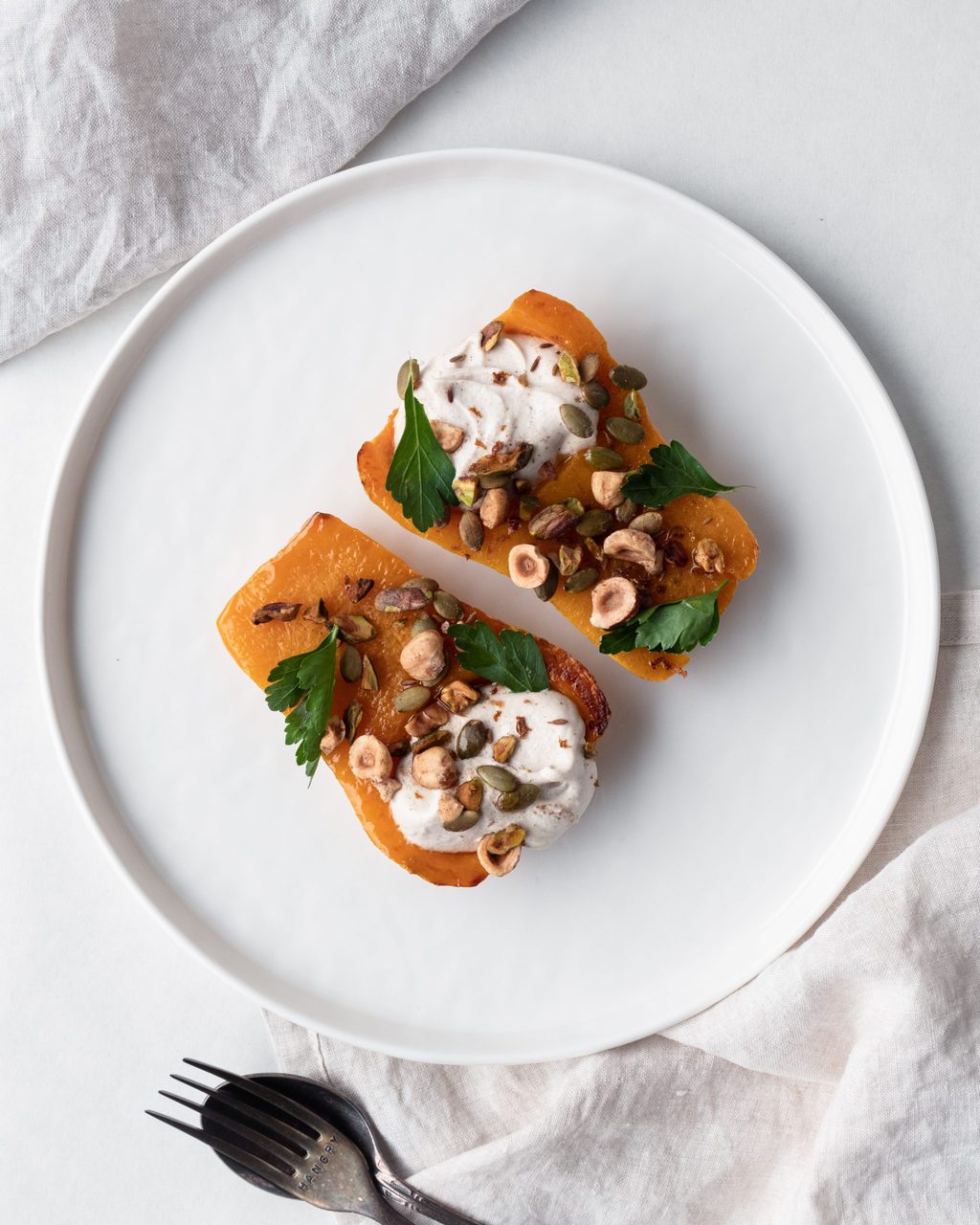 halved butternut pumpkin on plate from above