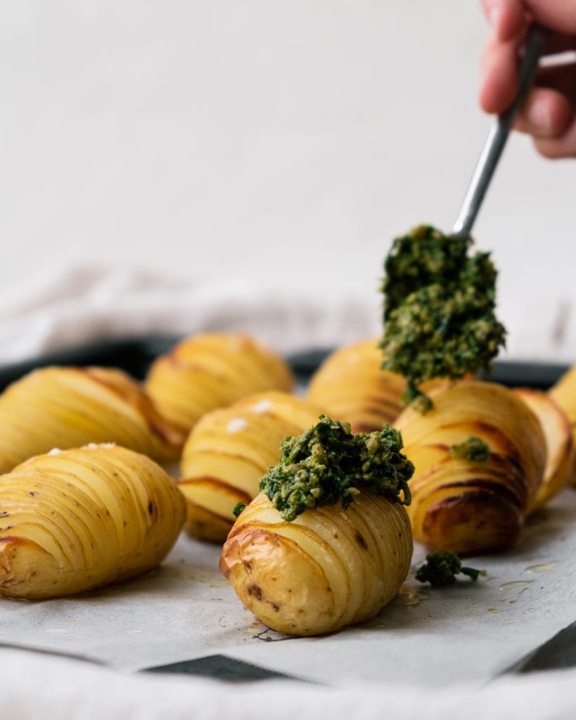 hasselback potatoes with spoon