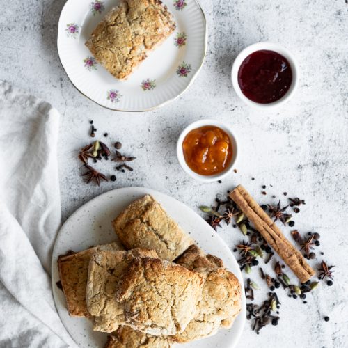 chai spiced scones with apricot and strawberry jam shot from above