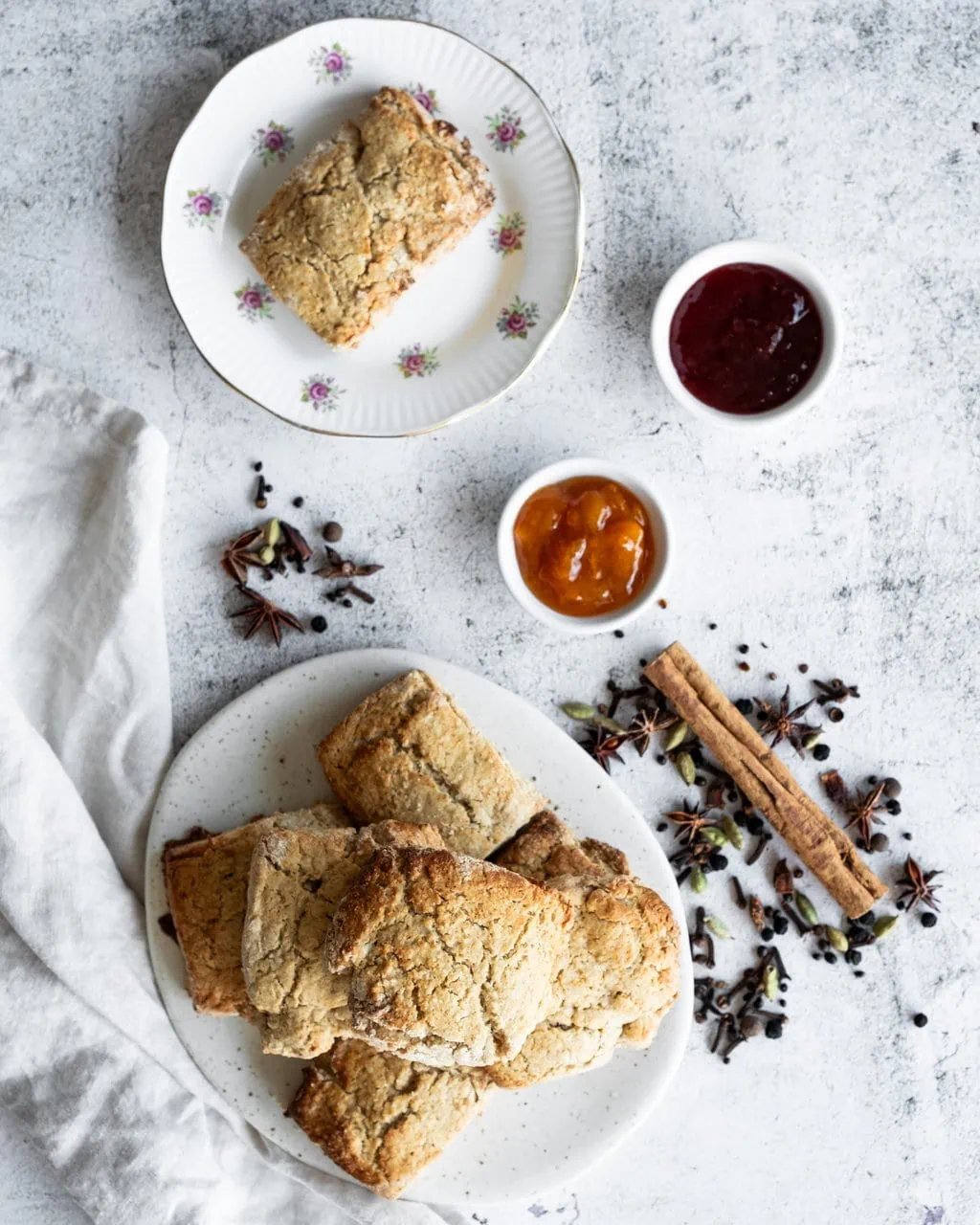 chai spiced scones with apricot and strawberry jam shot from above
