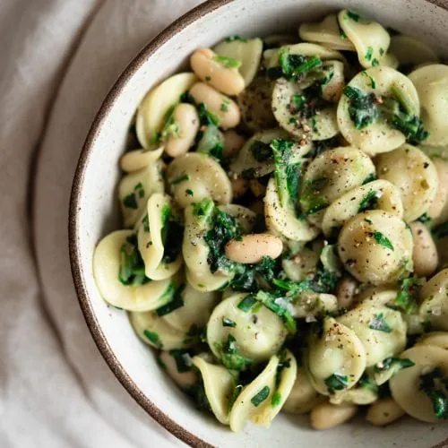 creamy spinach and cannellini bean pasta close up from above