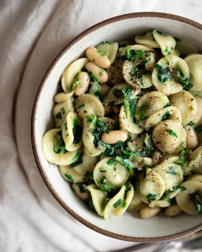 creamy spinach and cannellini bean pasta close up from above